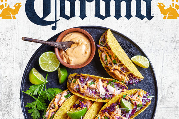 Portfolio: Corona logo and griffins above plated tacos for consumer packaged goods licensing style guide.